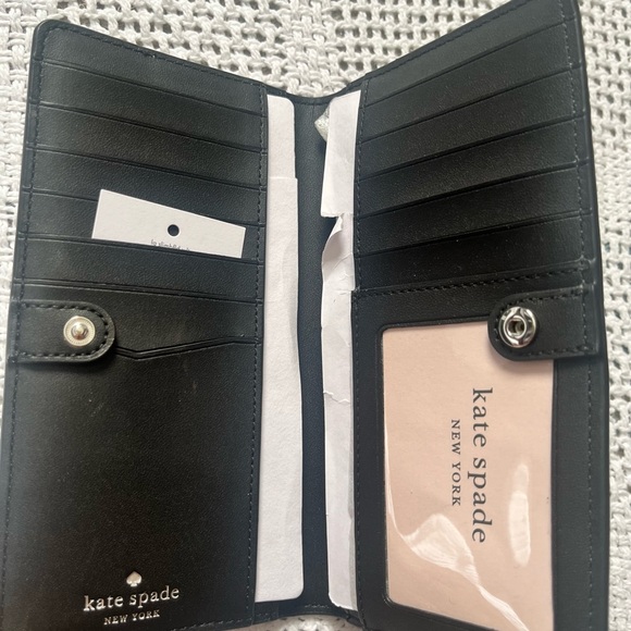 Kate Spade Staci Large Slim Bifold Wallet
Nimbus Grey/White - Picture 2 of 4